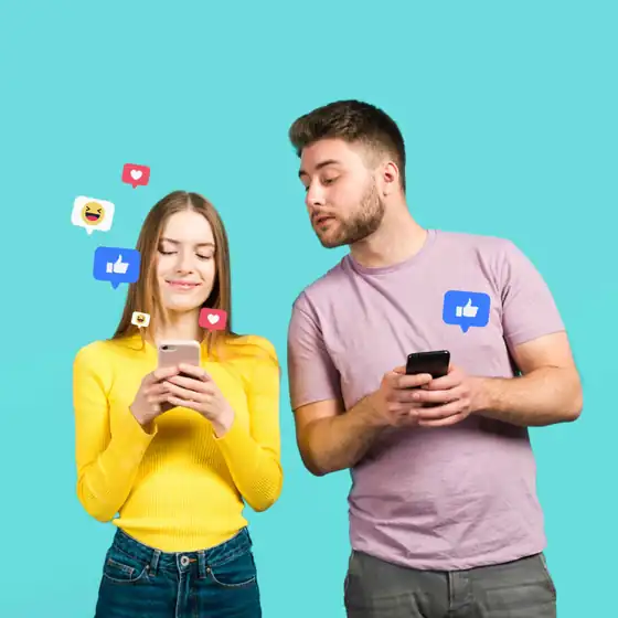 Social media audience reacting to content on their phones, with likes, hearts and laughing reactions floating above